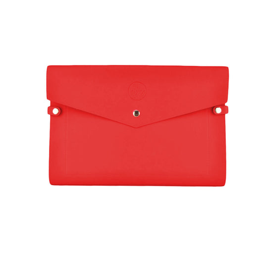 The Adele by Sonia's Vokalized Kreations is a sleek envelope-style clutch with cardholder slots, a secure button closure, and an embossed logo.