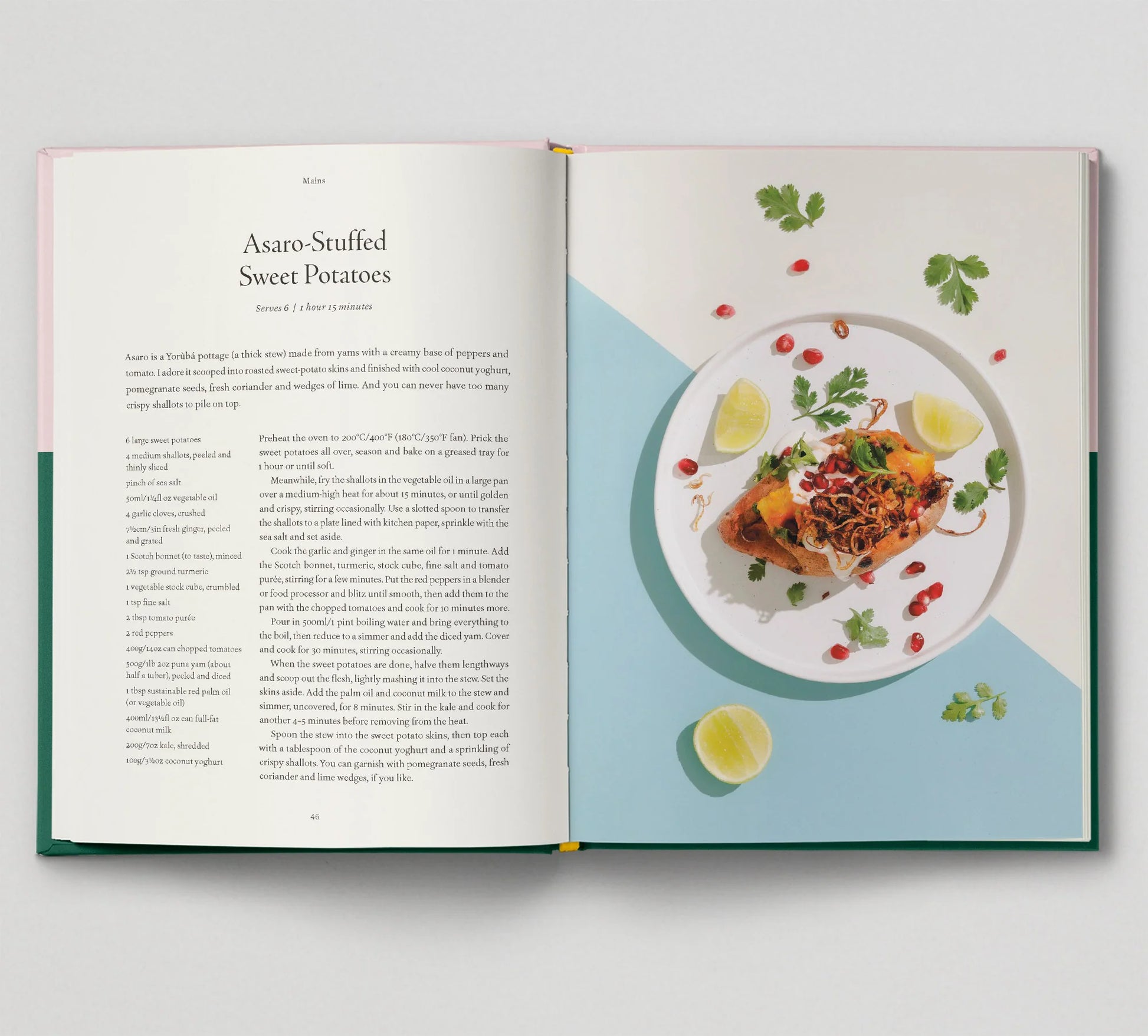 A recipe for Asaro-Stuffed Sweet Potatoes from the Afro-Vegan "Seasoned" cookbook by Sonia's Vokalized Kreations is open, displaying vibrantly plated sweet potatoes with pomegranate seeds, lime wedges, herbs, and a splash of Barbados hot pepper sauce.