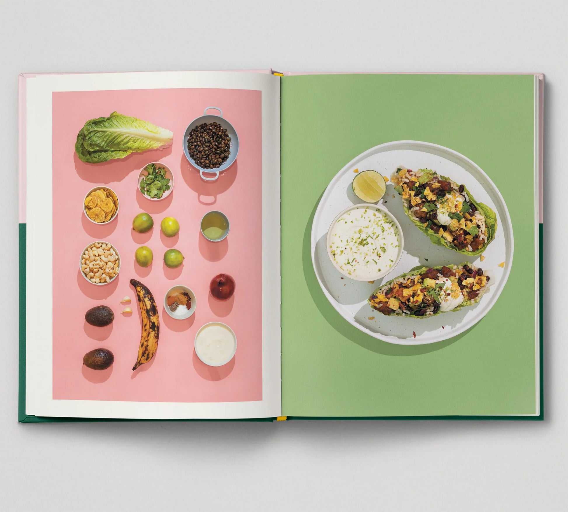 The left page presents colorful ingredients such as lettuce, beans, nuts, limes, plantain, and avocado. The right page displays stuffed avocados on a white plate with Barbados hot pepper sauce and lime—ideal for aficionados of the Afro-Vegan cookbook! From Sonia's Vokalized Kreations: Seasoned.