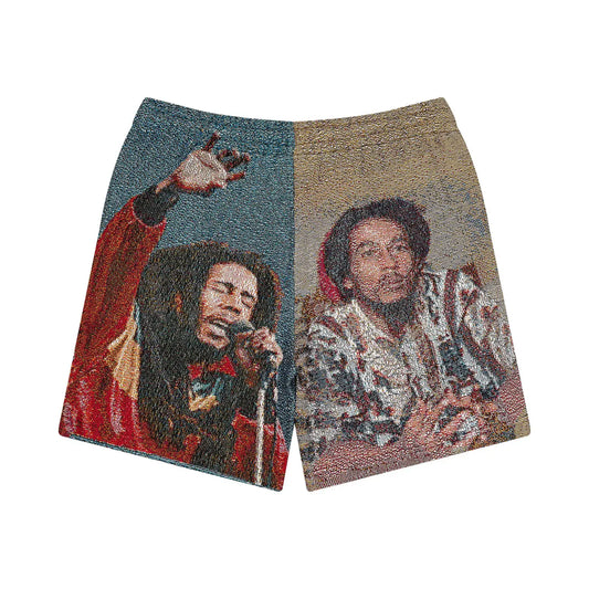 Bob Marley Tapestry Shorts by Sonia's Vokalized Kreations feature vibrant prints of a Rastafarian icon, one singing into a microphone and the other sitting casually, capturing the essence of reggae music.