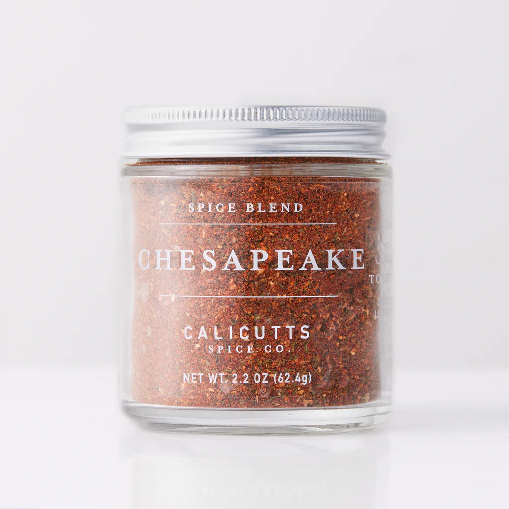 A 2.2 oz (62.4g) clear jar of Sonia's Vokalized Kreations Seasoned blend, featuring a metal lid, ideal for infusing bold flavors into your dishes.