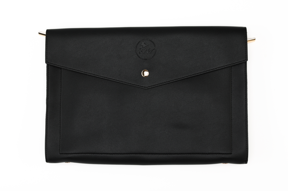 Introducing the Harlem & Brooklyn Bundle by Sonia's Vokalized Kreations: a black leather envelope-style clutch with a button closure and an embossed logo on the flap. Ideal for fans of timeless black accessories.