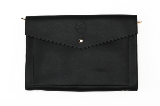 Introducing the Harlem & Brooklyn Bundle by Sonia's Vokalized Kreations: a black leather envelope-style clutch with a button closure and an embossed logo on the flap. Ideal for fans of timeless black accessories.
