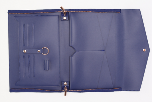 Open the Ja-Lyn laptop sleeve by Sonia's Vokalized Kreations in royal blue leather, featuring multiple compartments, zippers, and a key ring on a pristine white background.