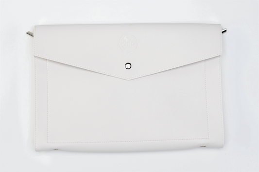 The Paloma clutch bag by Sonia's Vokalized Kreations is a bold statement piece featuring a white envelope-style design, rounded flap, button clasp, and subtle embossed logo.