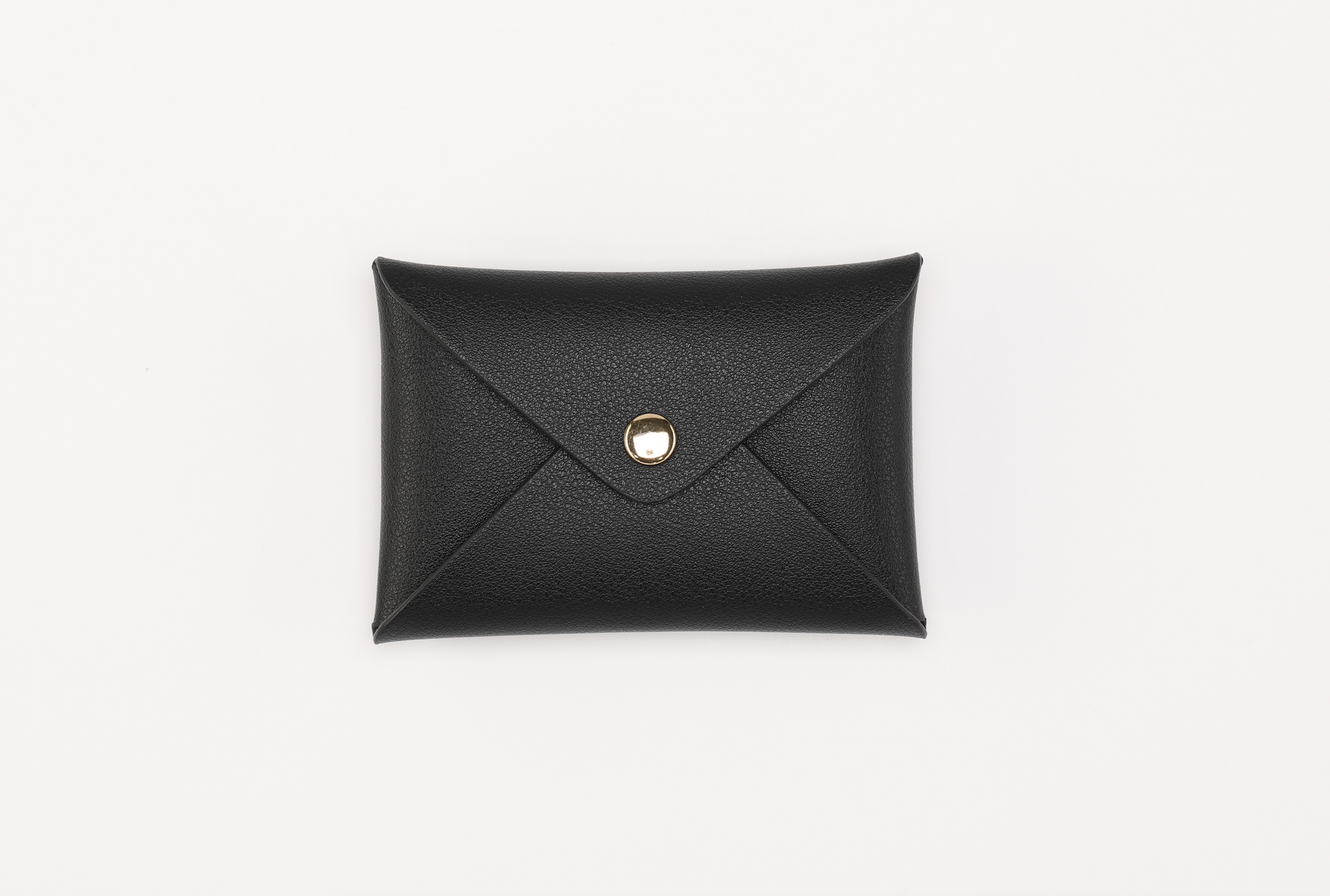 The Harlem Clutch, part of the Harlem & Brooklyn Bundle by Sonia's Vokalized Kreations, is a classic black leather envelope-style wallet with a button closure, elegantly displayed on a white background.