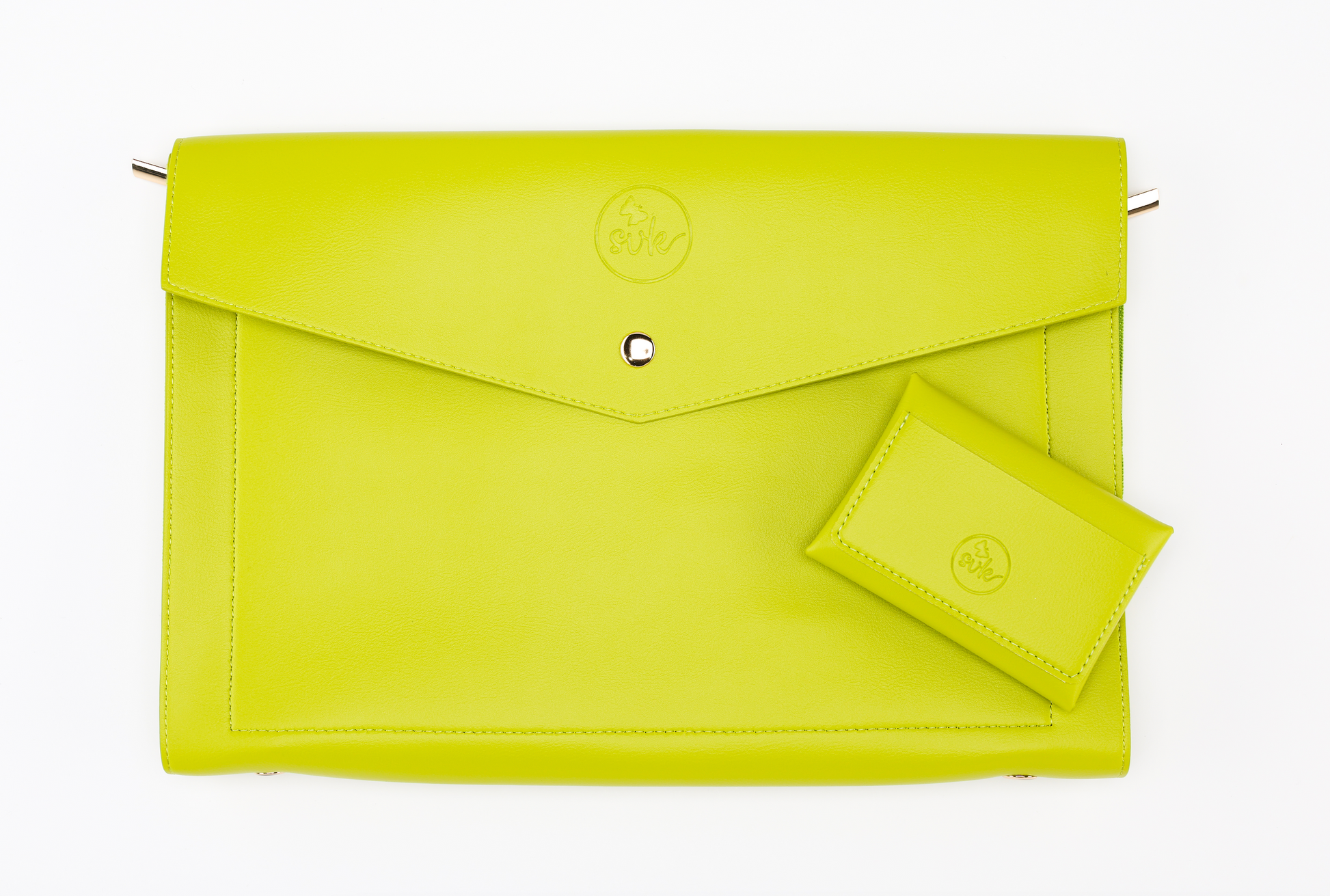 A lime green leather Pompei & Brooklyn Bundle rests elegantly on a white background, embodying the essence of empowering women through style. Brand: Sonia's Vokalized Kreations.