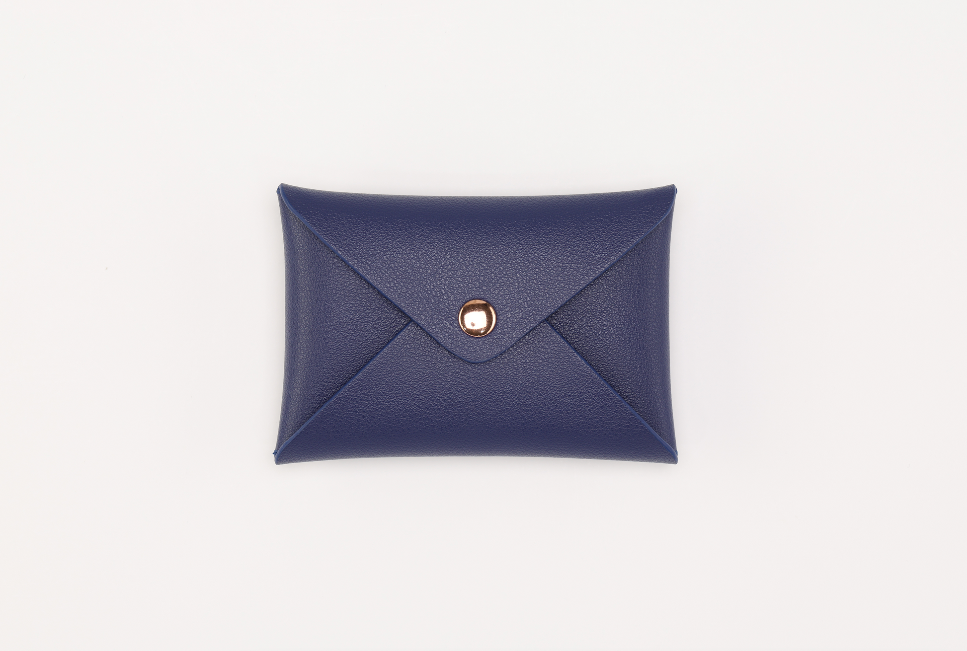 The Sonia's Vokalized Kreations Brooklyn Wallet 2.0 boasts a compact blue leather design with a snap button closure on a crisp white background.