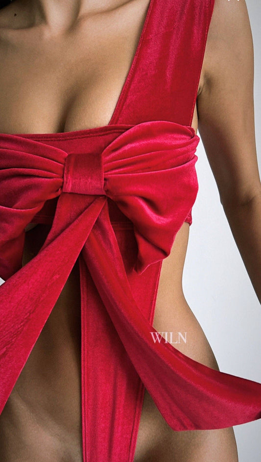 Wearing Sonia's Vokalized Kreations' Amaze Lingerie in red velvet with a large front bow, this outfit exudes sensuality and elegantly reveals the midriff.