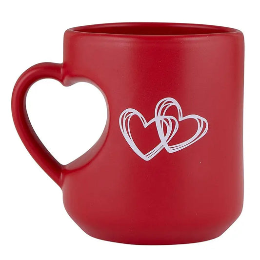 Sonia's Vokalized Kreations' Heart Mug: A red stoneware mug with a heart-shaped handle, featuring two overlapping white hearts on the side.