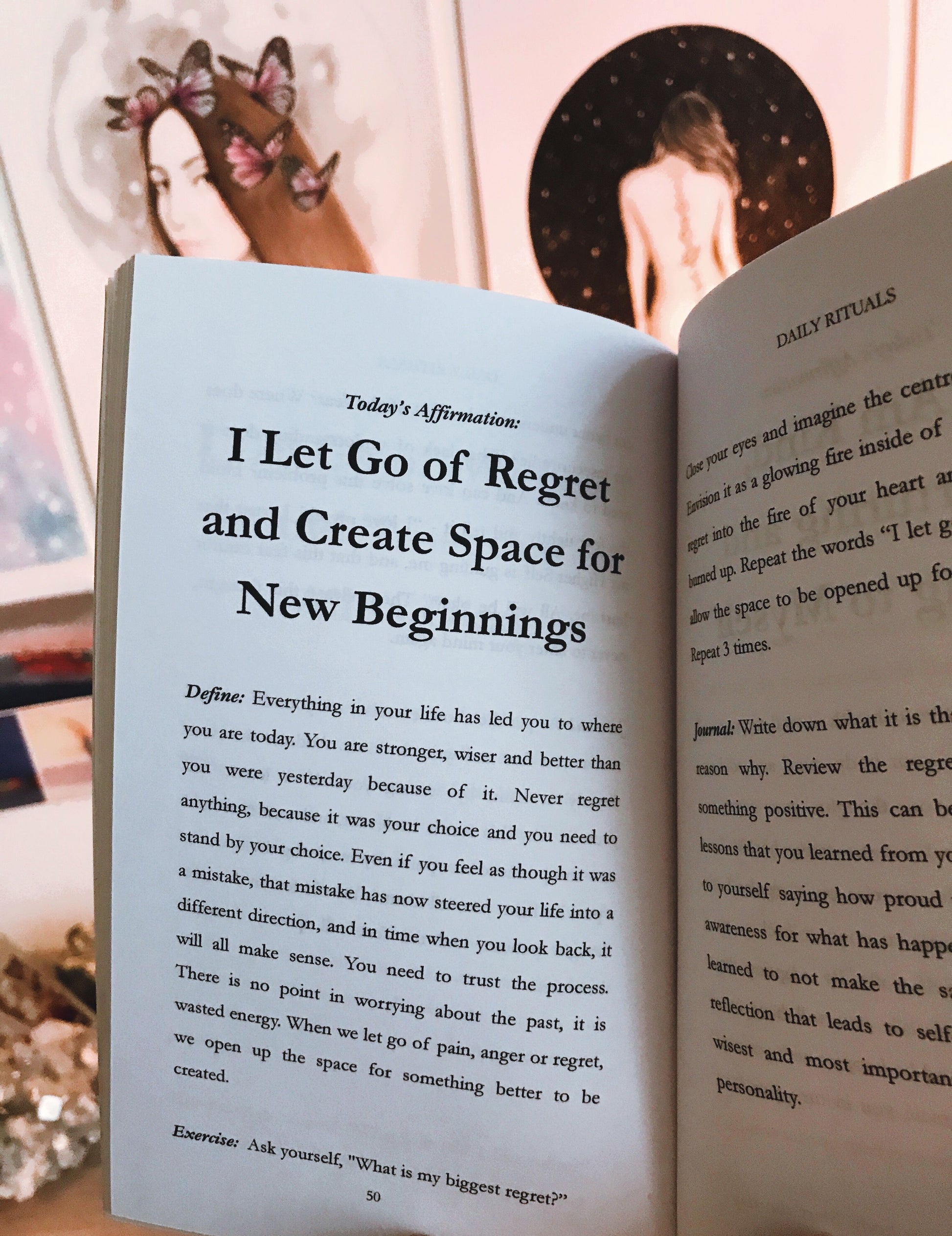 An open copy of "Don't Disturb My Peace" by Sonia's Vokalized Kreations displays an affirmation about letting go of regret for new beginnings. In the background, artwork of a woman adds tranquility, enhancing the message's serene invitation to inner harmony.