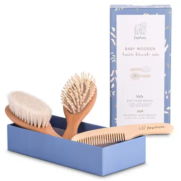 The "Mommy, Let's Cuddle!" Baby Hair Brush Set by Sonia's Vokalized Kreations includes a wooden soft bristle brush, a gentle massage brush with wooden pins, and a comb, all beautifully packaged in a blue box with decorative accents—ideal for any diaper clutch for on-the-go ease.