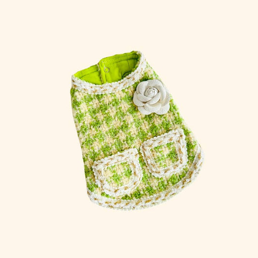 The Handmade Princess Style Pet Dress by Sonia's Vokalized Kreations is a green and beige houndstooth design with two pockets and a decorative flower on the back, expertly crafted.