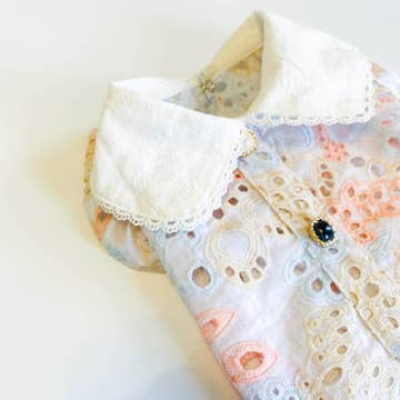 Sonia's Vokalized Kreations' Summer Princess Vintage Style Handmade Pet Dress-Shirt features intricate pastel patterns on a light background with a white collar and brooch. The breathable material ensures comfort and elegance all day.