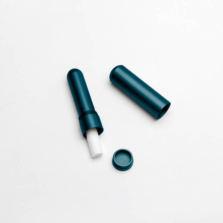 The New Baby Gift Box for Mom & Baby by Sonia's Vokalized Kreations features a teal metal cylinder with a white stick, shown open with cap and lid beside it—ideal for postpartum care or as a thoughtful custom shower gift.
