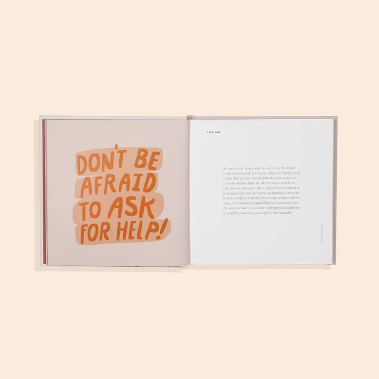 An open book features "DON'T BE AFRAID TO ASK FOR HELP!" in orange on one page and printed text on the other—a thoughtful addition to Sonia's Vokalized Kreations' New Baby Gift Box for Mom & Baby, ideal for showers or postpartum care.