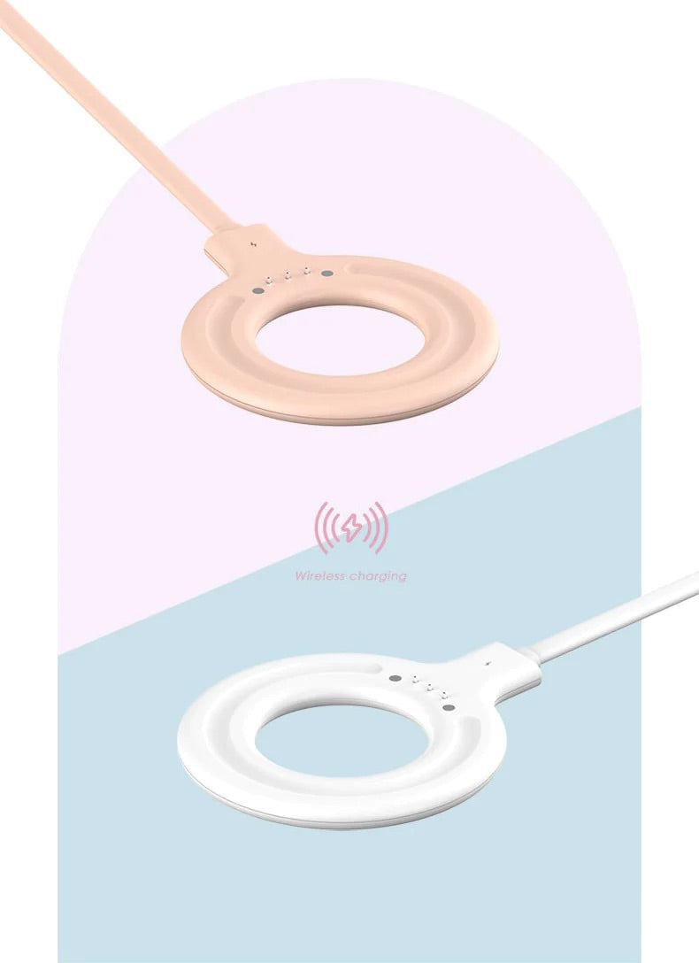 Two circular, BPA-free wireless chargers with a sleek design, one beige and the other white, are set diagonally against a light pink and blue split background. From Sonia's Vokalized Kreations' Portable Blender Bottle collection.