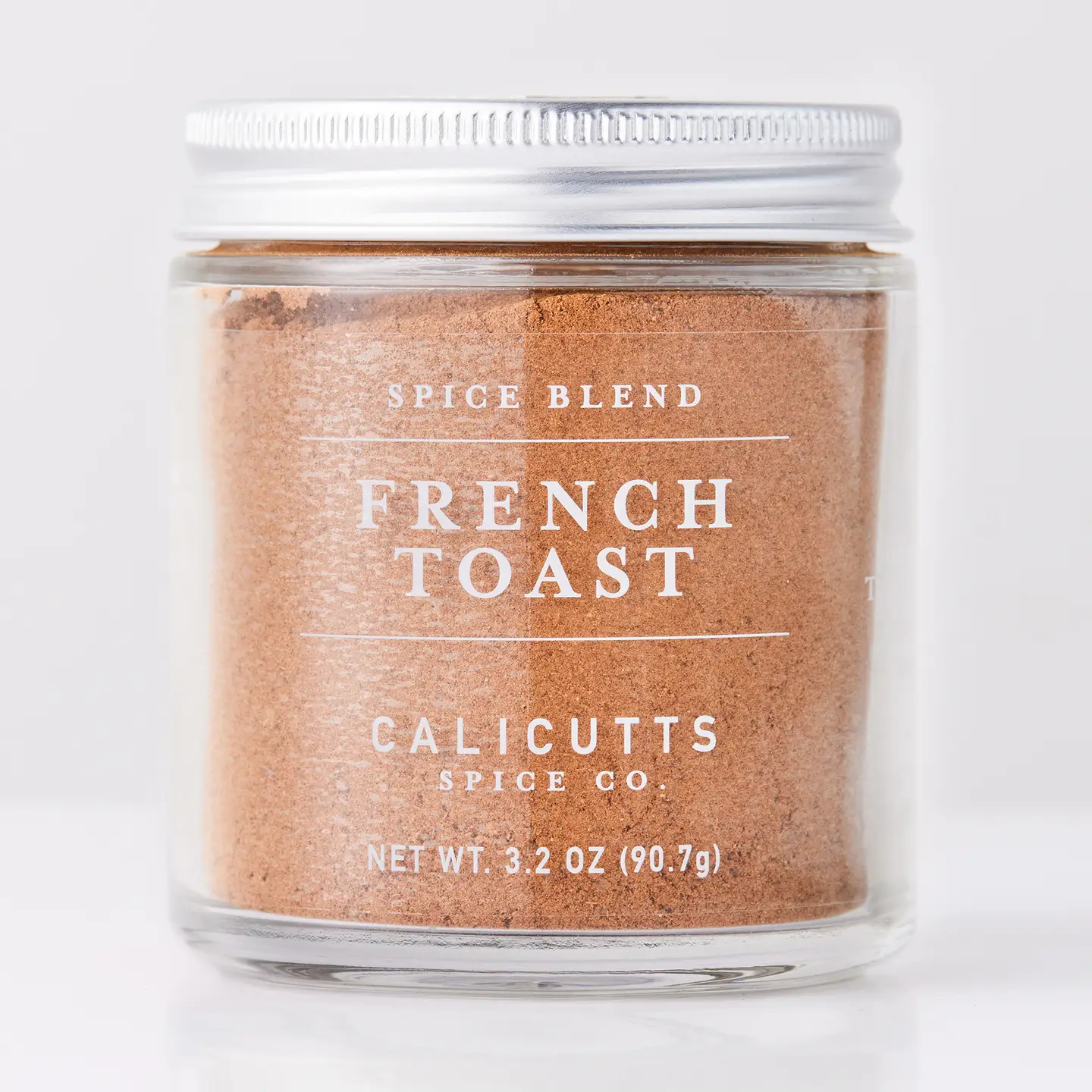 The "Let's Brunch Kitchen Housewarming Gift Box" by Sonia's Vokalized Kreations features a 3.2 oz (90.7g) brown spice blend in a glass jar with metal lid—perfect for cozy mornings or as a thoughtful brunch gift.